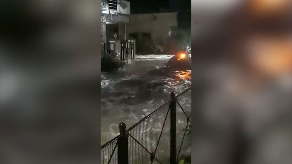Vehicle washes away in Hyderabad following heavy rain in the city