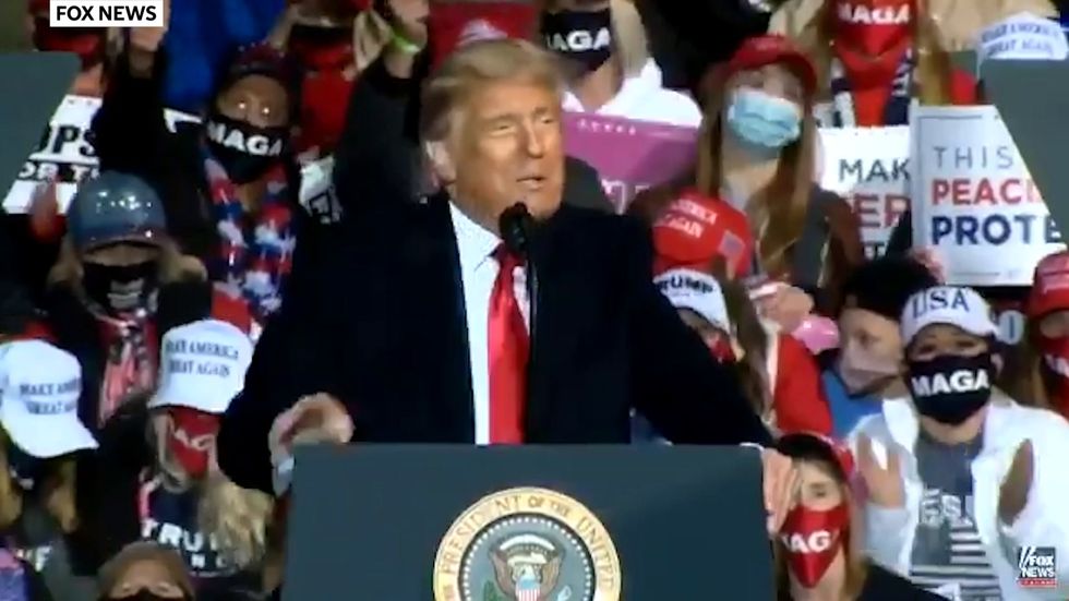 'Look at that handsome guy I'd kiss him': Trump falsely tells crowd he and other covid survivors are now immune