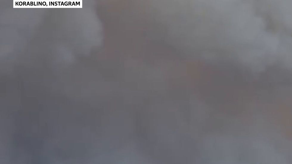 Witnesses hear munitions exploding after depot catches fire in Russia