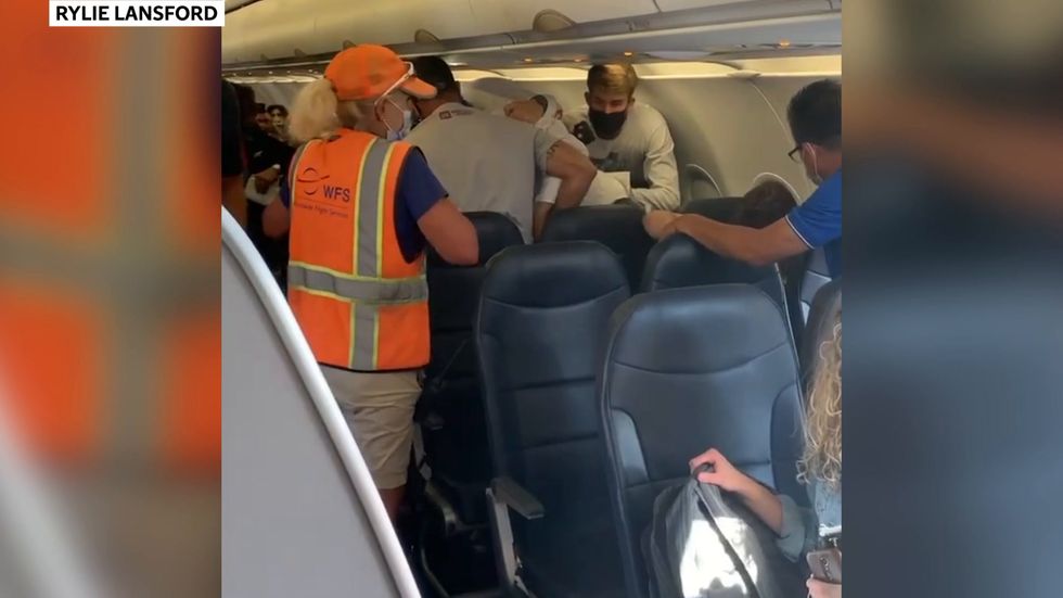 Fight breaks out on flight after man refuses to wear masks