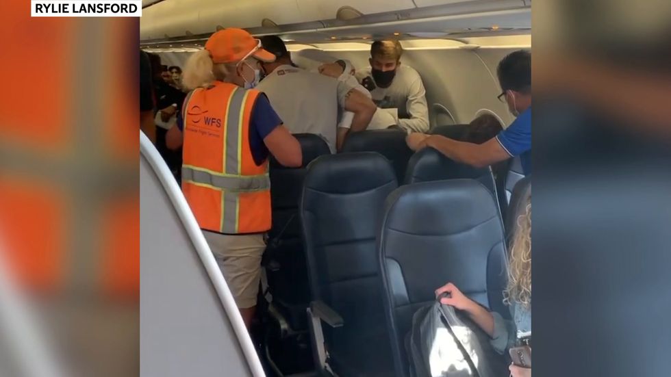 Fight breaks out on flight after man refuses to wear masks