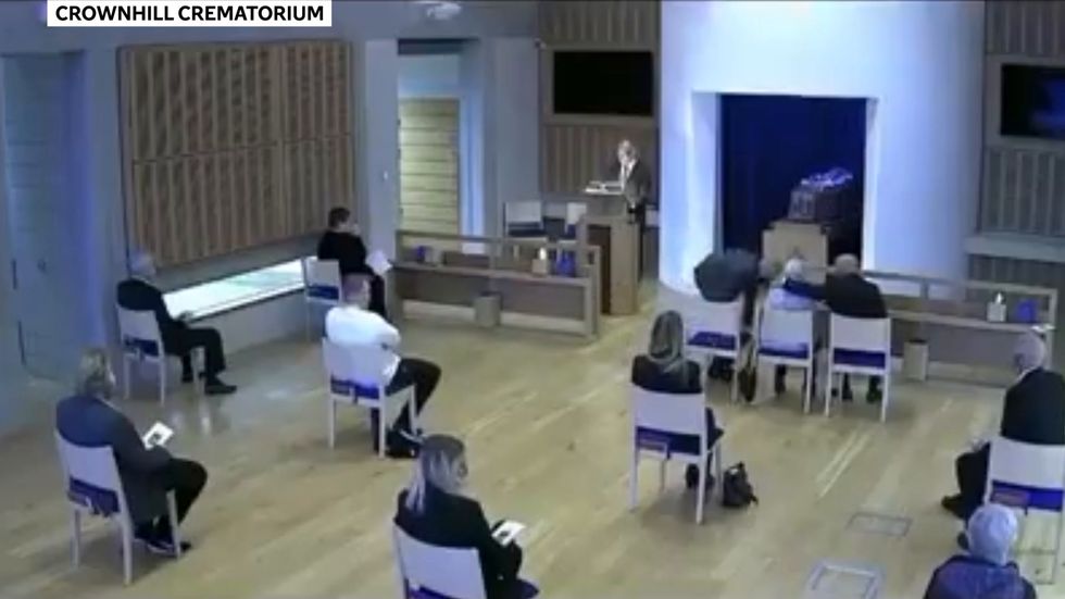 Crematorium worker scolds brothers for breaking Covid-19 rules to comfort mother at father's funeral