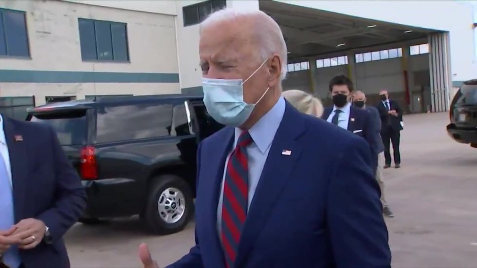 Joe Biden's wife makes sure he socially distances with press