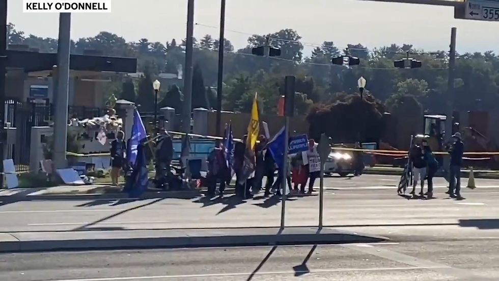 Trump supporters sing 'Born in the USA' outside hospital president is staying