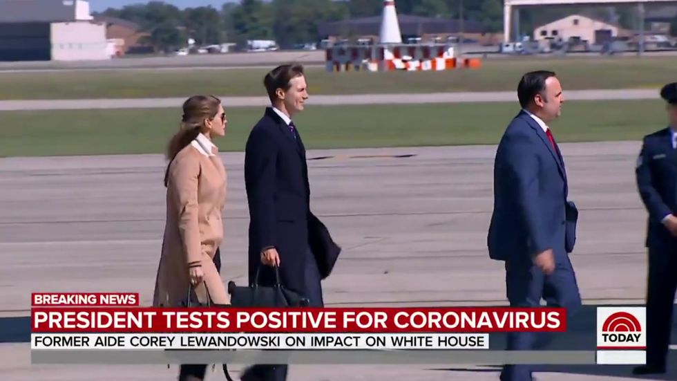 Covid-positive Hope Hicks touches Air Force railing ahead of top aides like Kushner