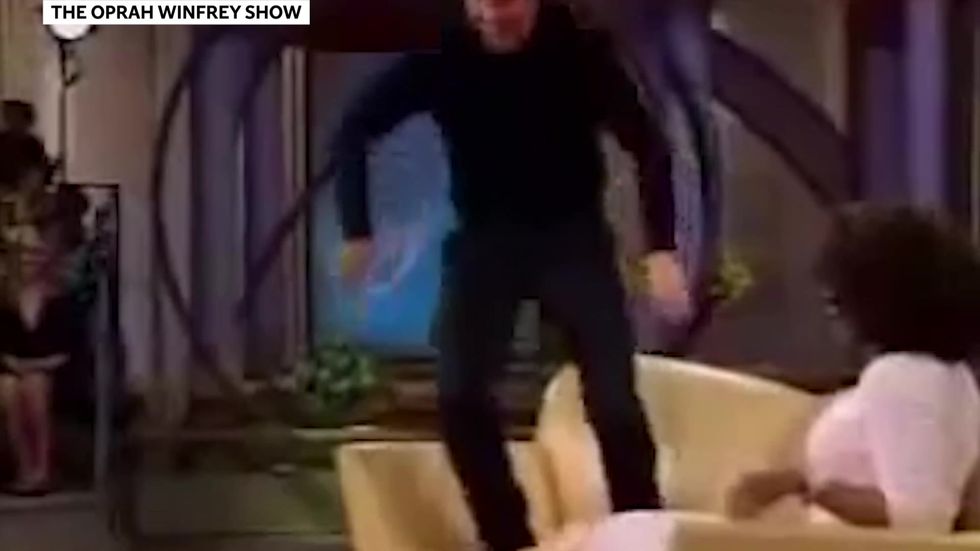 Tom Cruise jumps on Oprah's sofa
