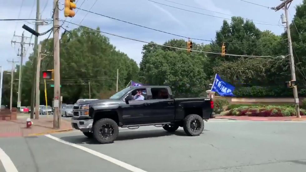 Pastor shouts 'White power' during trump parade
