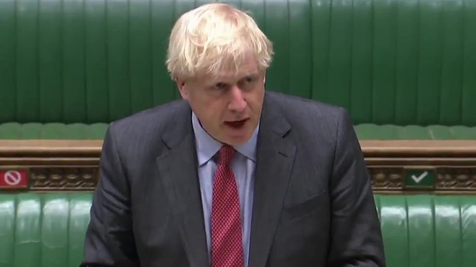 Boris Johnson says restrictions could remain in place for at least 6 months
