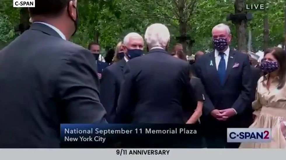 Joe Biden taps Mike Pence on the shoulder and gives Karen Pence elbow bump at 9/11 memorial