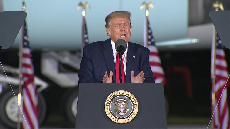 Trump calls Bob Woodward a 'whack job' during Michigan rally