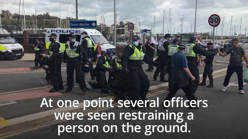 Anti-migrant protesters clash with police in Dover