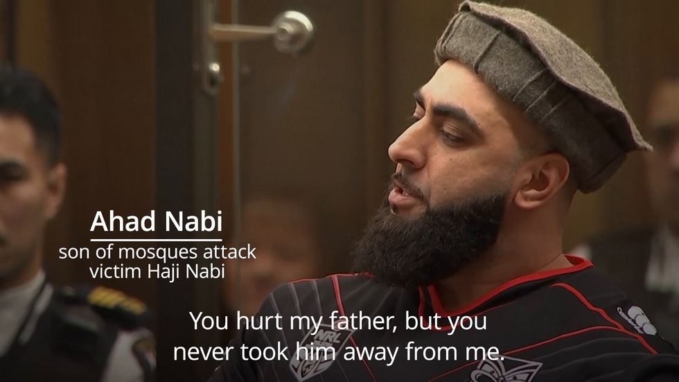 Son of Christchurch victim raises middle fingers to 'maggot' gunman in court