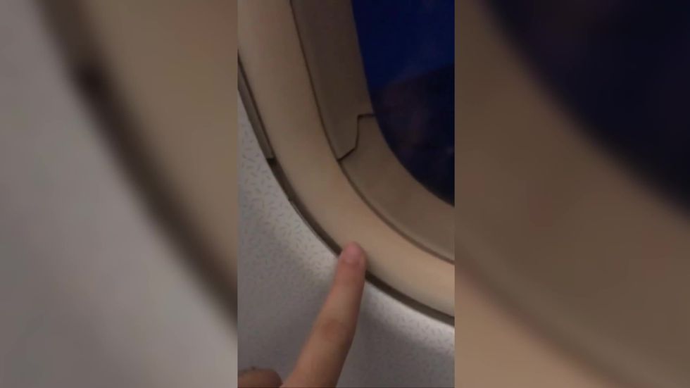 Man wakes up to find a crack in plane window next to him