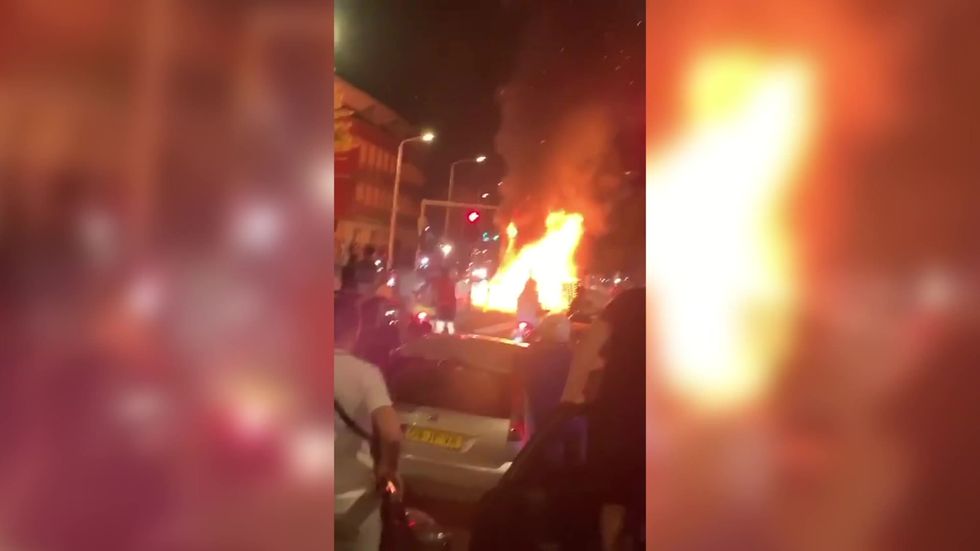 Rioters set fire to steet in The Hague, Netherlands