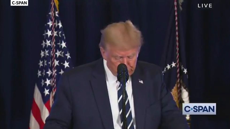 Trump cheered by golf club guests as he says they don't have to wear masks