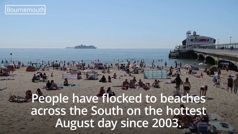 Beachgoers bask on hottest August day in 17 years