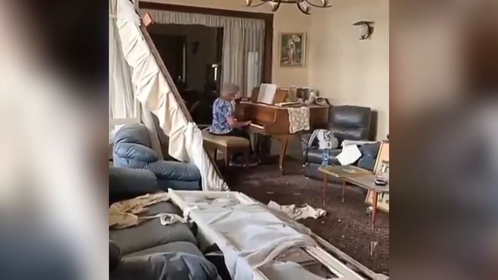 Beirut woman plays piano amongst wreckage of apartment