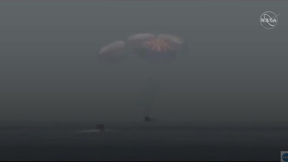 SpaceX splashdown hailed as success