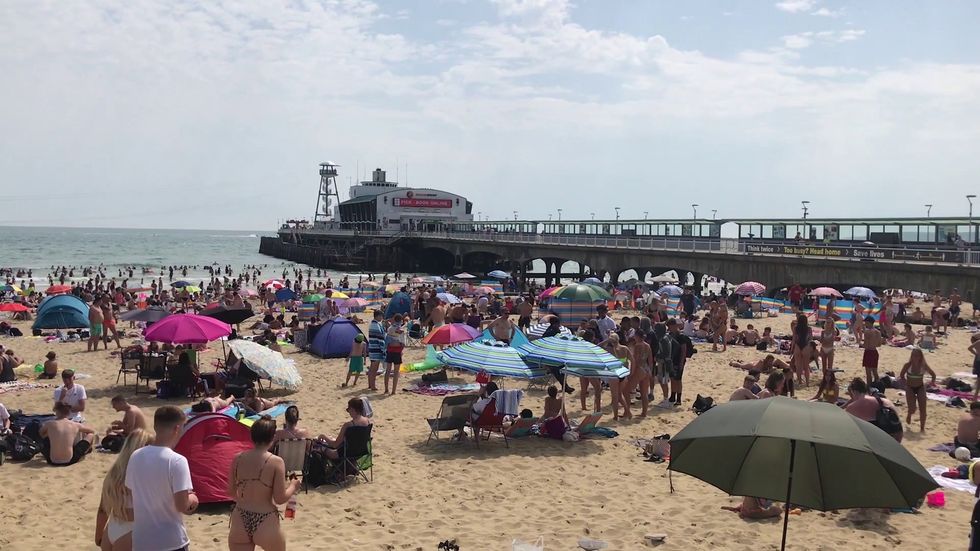 Bournemouth beach packed as UK basks in hot weather