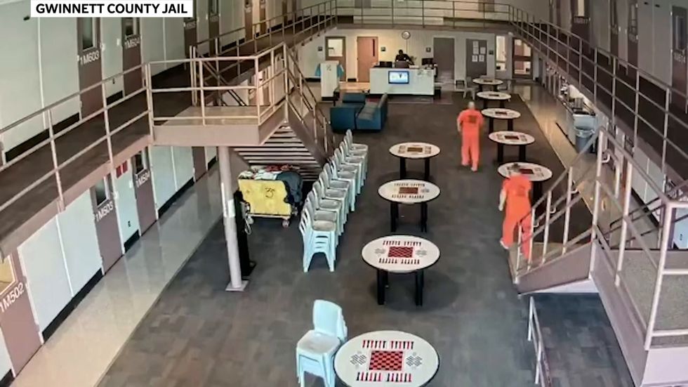 Georgia inmates seen on CCTV rushing to save life of guard who suffered heart attack