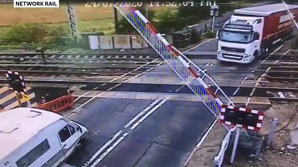 Lorry driver drives straight through level crossing barrier in Essex