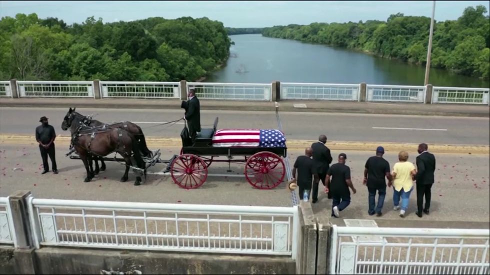 John Lewis' body crosses Edmund Pettus bridge in Selma