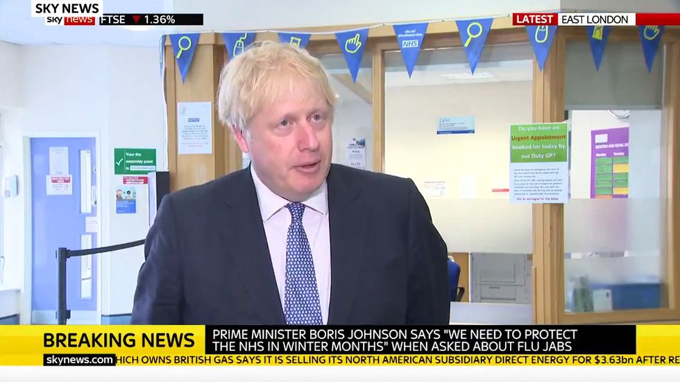 Coronavirus will afflict UK until 'the middle of next year', Boris Johnson admits