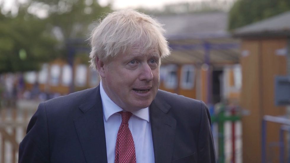 Boris Johnson said he could not be '100% confident' that a vaccine would be available this year or next year
