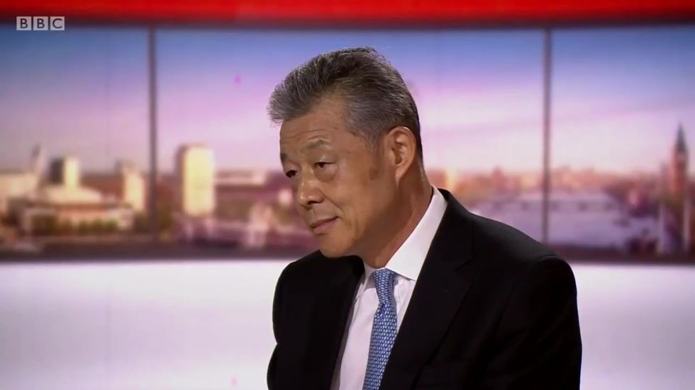 Chinese ambassador confronted with footage appearing to show blindfolded Uighur Muslims being led onto train
