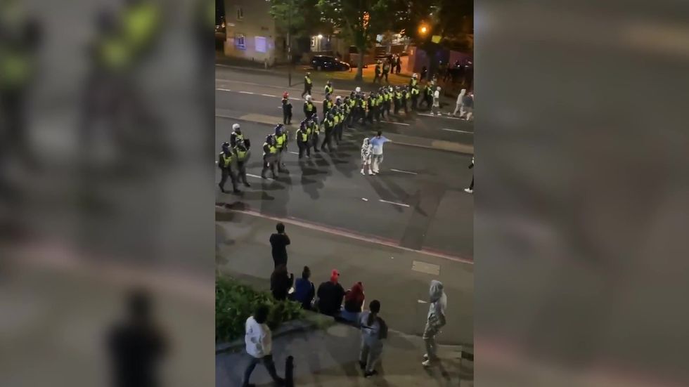 Riot police clash with ravers at illegal event in north London