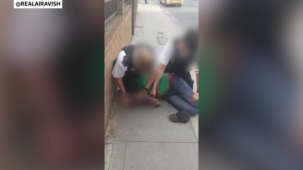 Met Police officer filmed kneeling on black man's neck during arrest