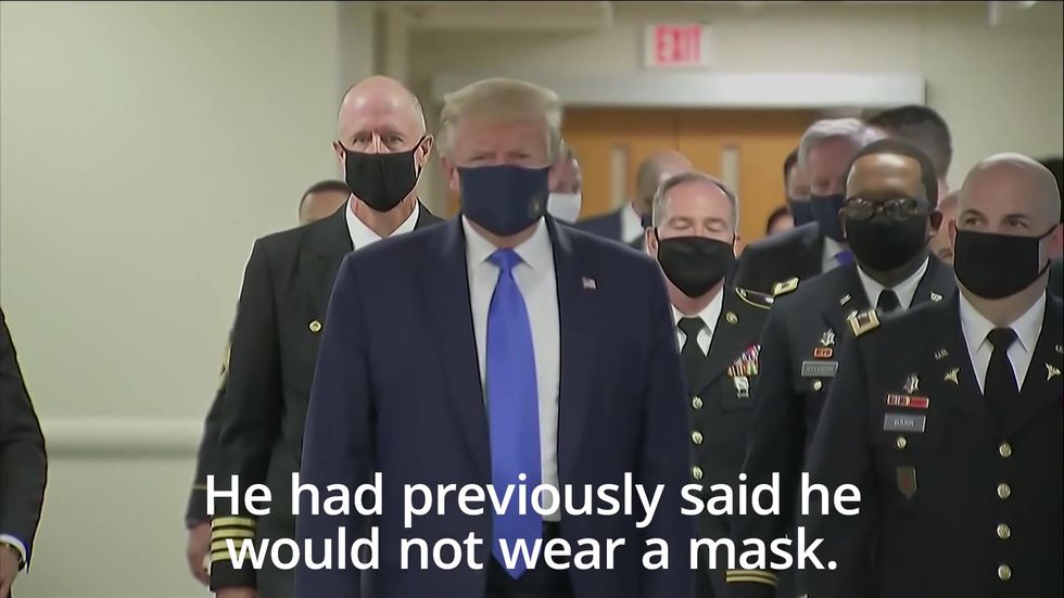 Trump seen wearing a face mask in public for the first time