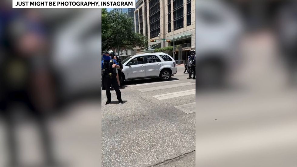 Police officer appears to grope woman during arrest