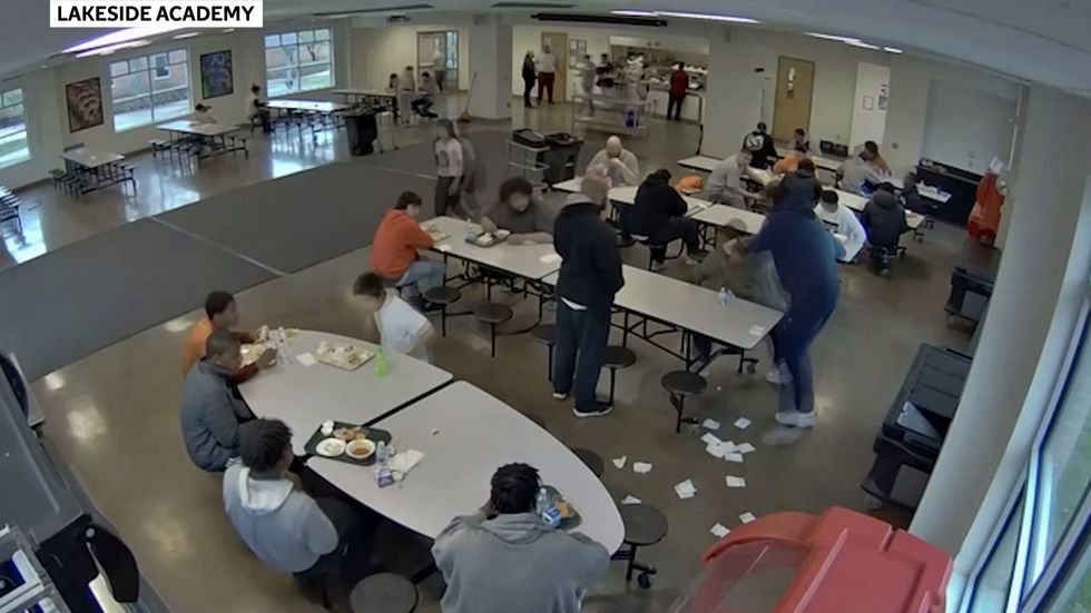 CCTV shows seven men pinning down black teen who later died after being restrained for throwing a sandwich