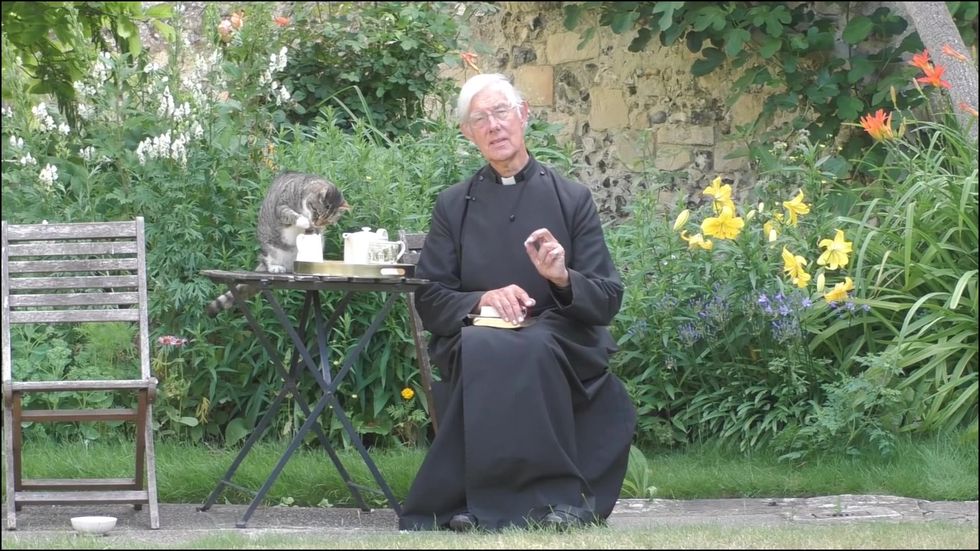 Canterbury Cathedral cat steals milk during morning prayer