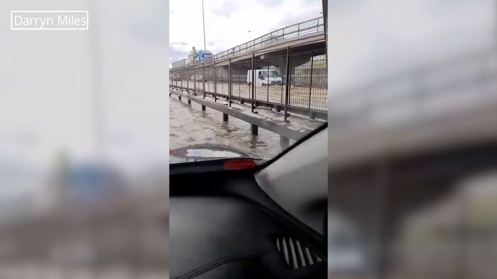 'Eight people rescued after burst water main flooded London road