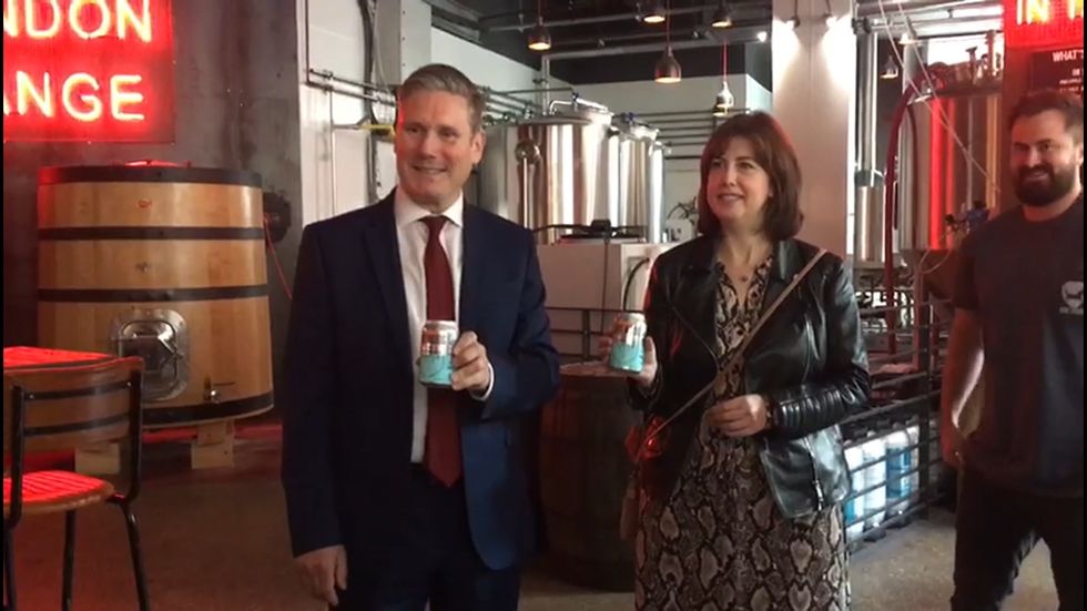 Keir Starmer poses with can of 'Barnard Castle eye test' beer