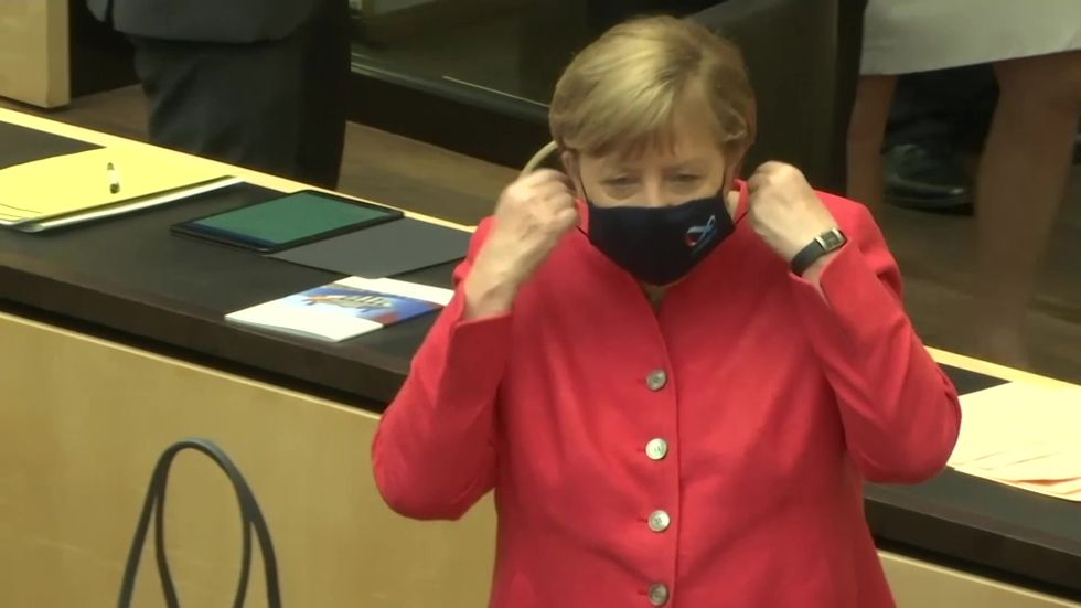 Angela Merkel seen wearing mask in public for first time as she enters German Bundesrat