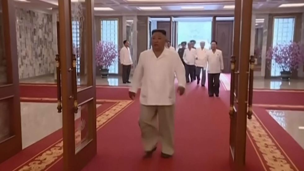 Kim Jong Un appears at his Workers' Party meeting to discuss latest on coronavirus