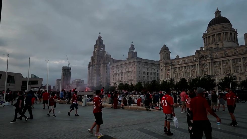 Police take extra powers in Liverpool as Liver Building burns amid celebrations