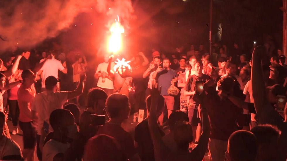 Liverpool fans celebrate into the night after Premier League title win