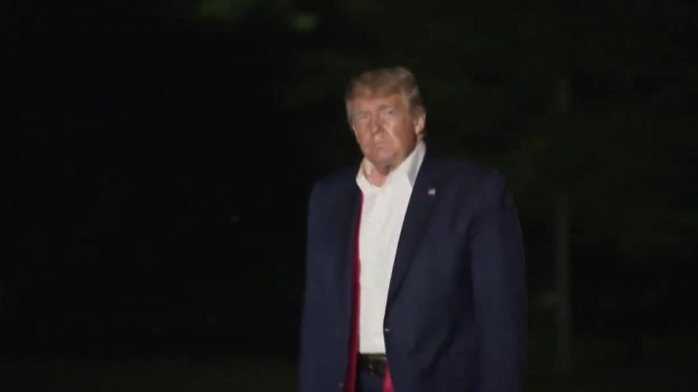 Trump returns from underwhelming Tulsa rally holding 'MAGA' hat