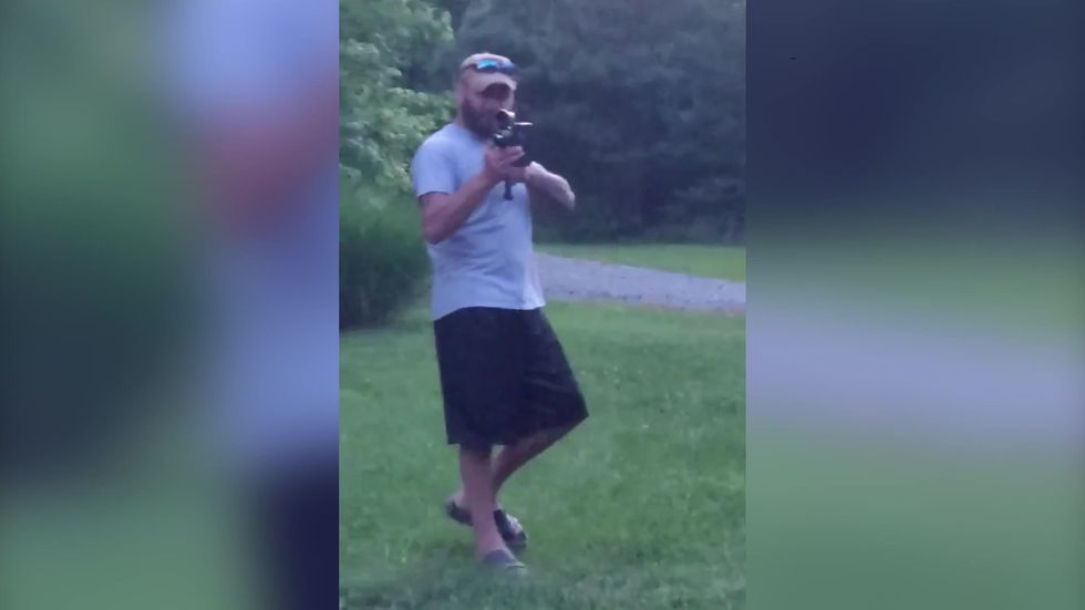 Disturbing video shows white man pointing a rifle at black bikers taking a rest