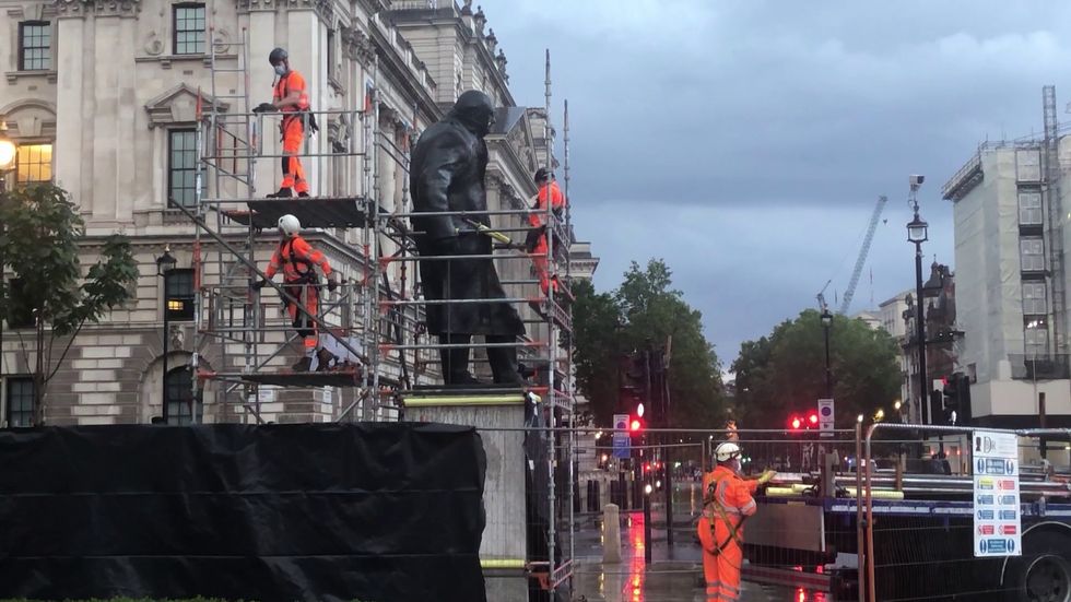 Winston Churchill statue uncovered in Westminster ahead of French President's visit