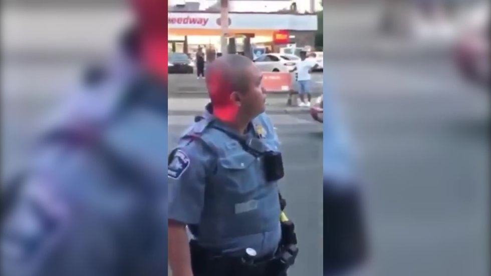 Officer ignores onlooker's calls not to let George Floyd die
