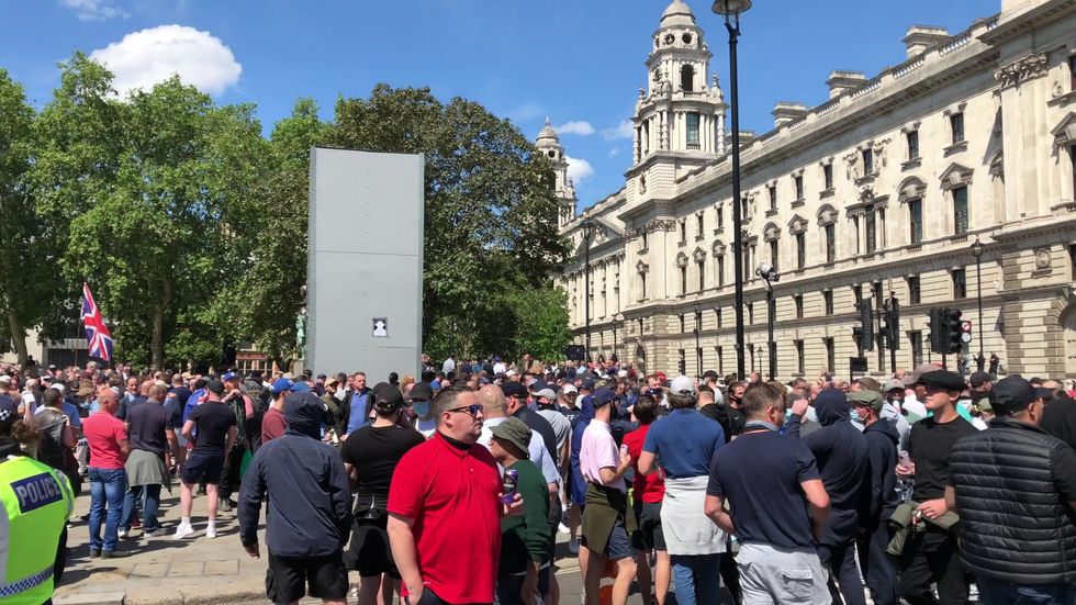 'Football Lads Alliance supporters' gather in Westminster in anticipation of rival demonstrations from anti-racist protesters