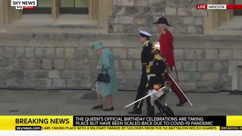 The Queen attends military parade in grounds of Windsor Castle to celebrate official birthday