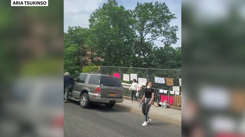 Man who charged at protesters with 'Wolverine' knife claw glove is arrested