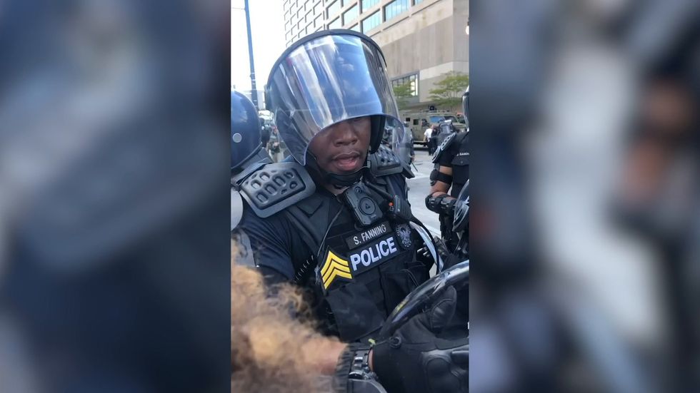 'I'd like to be out here helping you' Atlanta police officer mediates with George Floyd protesters