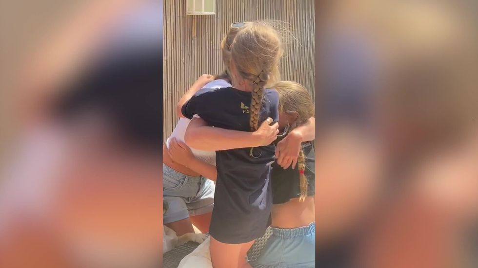 Mum working on NHS frontline is reunited with daughters - after being apart for nine weeks